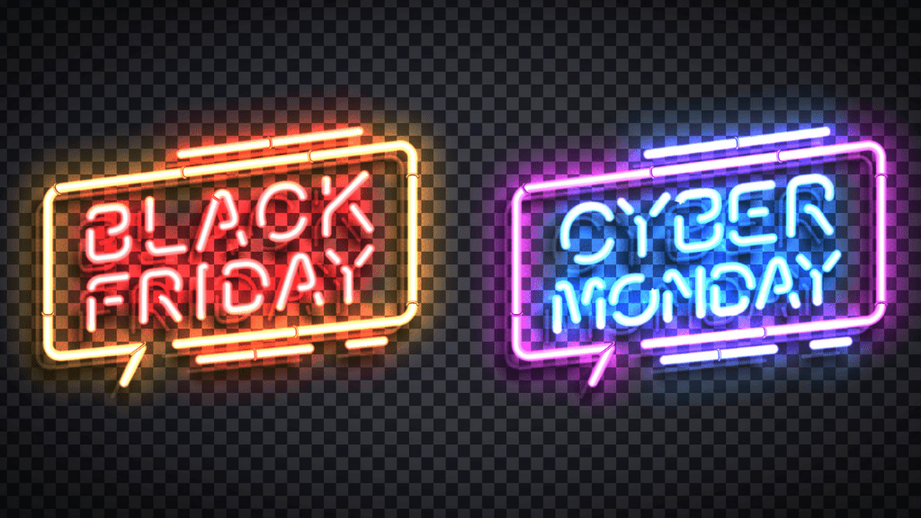 Two neon signs hang on a wall, representing two days in the Cyber 5 holiday; Black Friday is written in red and Cyber Monday in blue.
