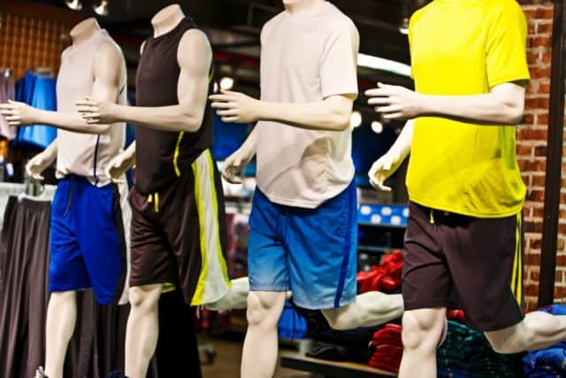 Four mannequins with athletic wear on display