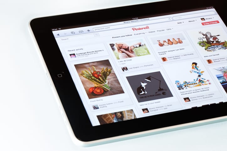 Social media platform Pinterest being viewed on a tablet.