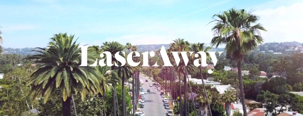 LaserAway logo overlaid on a landscape of the horizon and palm trees.