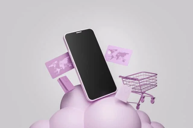 mobile phone on a cloud of spheres with a shopping cart and credit cards around it. concept of online shopping, offers and business.