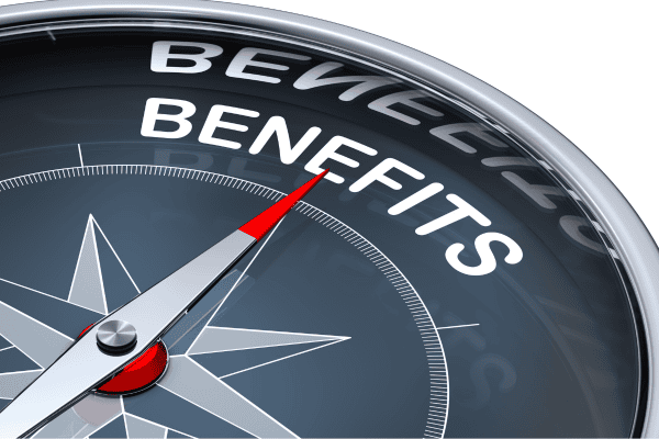 A close-up of a compass with the needle pointing toward the word BENEFITS in bold white letters, symbolizing guidance or direction toward benefits.