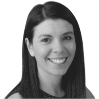 Smiling woman with straight, dark hair, wearing a sleeveless top, looking directly at the camera against a plain white background, embodying the confidence that comes from understanding the importance of omnichannel strategies.
